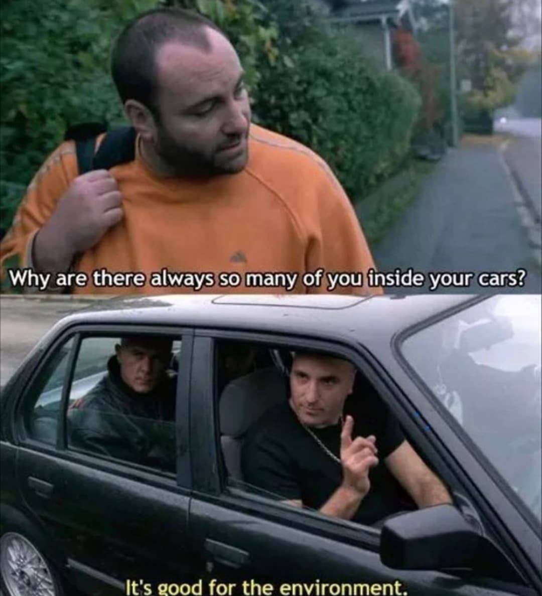 The meme is a two-panel image. The top panel shows a man with a confused expression, while the bottom panel shows a car with three men inside, one of whom is making a "V" gesture with his hand. The top panel has the text "Why are there always so many of you inside your cars?" and the bottom panel has the text "It's good for the environment."